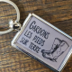 Porte-clefs Gardons les pieds sur terre